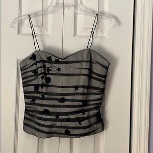 Dressy black top with flower  size 6